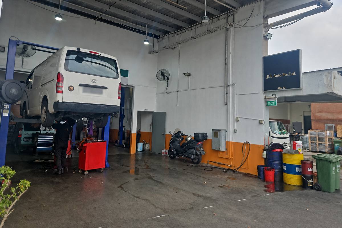 Van on the lift in the workshop